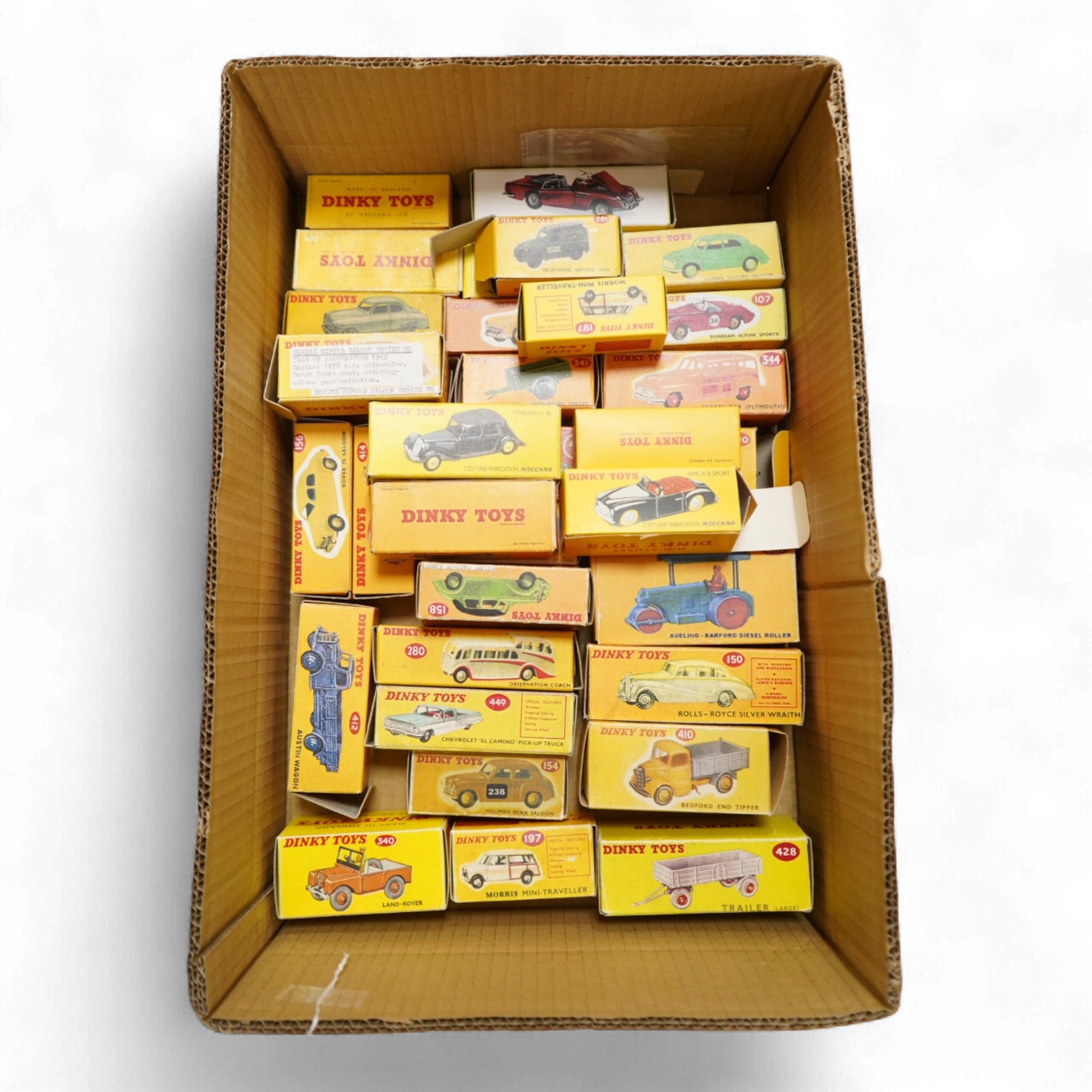 Thirty-two Dinky Toys, all playworn, restored, repainted or overpainted examples in reproduction boxes, including cars and light commercial vehicles
